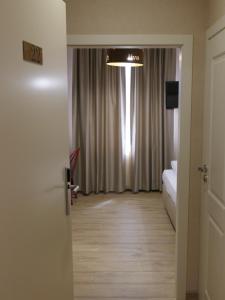 Postel nebo postele na pokoji v ubytování Hotel MEDITERRANEO
