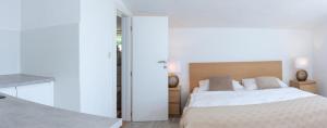Posteľ alebo postele v izbe v ubytovaní The View Split. Highlight with Roof-Top-Terrace and Pool + 31 fotografií