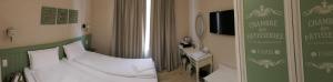 Postel nebo postele na pokoji v ubytování Hotel MEDITERRANEO