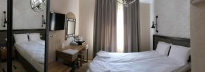 Postel nebo postele na pokoji v ubytování Hotel MEDITERRANEO