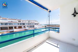 a view from the balcony of a building with a swimming pool at Apartamentos Poblado Marinero Casa Azahar in Alcossebre
