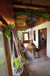 a room with a table and chairs and a dining room at Fisheye Villa in El Nido