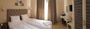 Postel nebo postele na pokoji v ubytování Hotel MEDITERRANEO