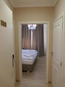 Postel nebo postele na pokoji v ubytování Hotel MEDITERRANEO