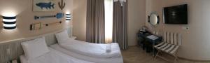 Postel nebo postele na pokoji v ubytování Hotel MEDITERRANEO