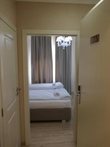Postel nebo postele na pokoji v ubytování Hotel MEDITERRANEO
