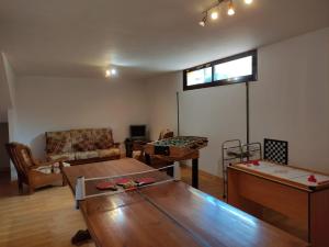a living room with a couch and a table at Casa San Miguel in Huércanos