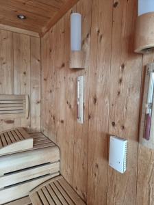 a sauna with wooden walls and two bunk beds at Grimm's Potsdamer Platz in Berlin