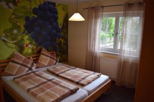 a bedroom with a bed with a balloon wall at Ferienhaus & Weingut am Steingebiss in Billigheim-Ingenheim