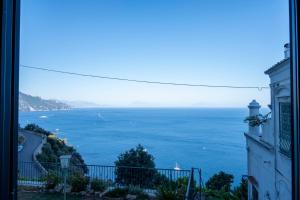 a view of the ocean from a building at Emerald's Resort - Rachele in Conca dei Marini +2 photos