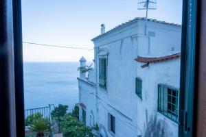 a view of the ocean from a building at Emerald's Resort - Rachele in Conca dei Marini