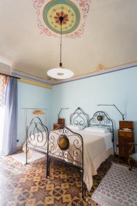 Posteľ alebo postele v izbe v ubytovaní Palazzo Previtera Hotel & Restaurant