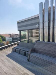 a bench on the roof of a building at Grimm's Potsdamer Platz in Berlin