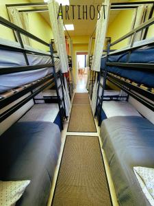 a group of bunk beds in a room at Artihost in Panevėžys