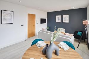 a living room with a table and a couch at Host & Stay - North Quay Apartments in Seaham