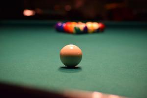 a cue ball on top of a pool table at Chalet H Montafon in Gaschurn