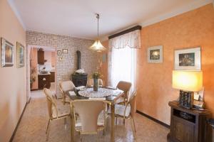 a dining room with a table and chairs at Family friendly apartments with a swimming pool Sumber, Central Istria - Sredisnja Istra - 7332 in Nedeščina