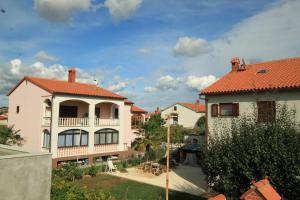 a large house with a red roof at Apartments with a parking space Pula - 7321 in Valdebek