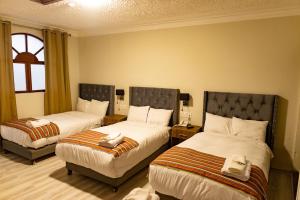 Postel nebo postele na pokoji v ubytování Casona Plaza Hotel Cusco
