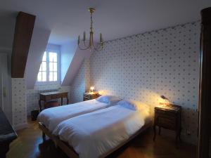 Łóżko lub łóżka w pokoju w obiekcie ImaginaSoi