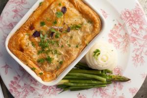 a plate of food with a pie and some green beans at The Gannet Inn in St Ives