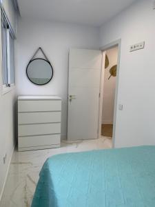 Posteľ alebo postele v izbe v ubytovaní Apartamento Casa Blanca