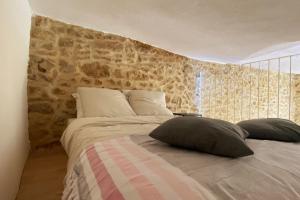 Katil atau katil-katil dalam bilik di La Bergerie de Carmen