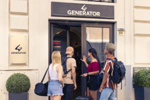 a group of people standing outside of a store door at Generator Rome in Rome