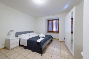 Letto o letti in una camera di Osteria Pozzo