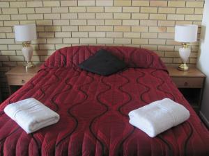 Postel nebo postele na pokoji v ubytování Nambour Central Motel