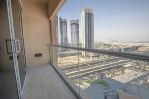 an empty room with a view of a city at Emaar Fashion Avenue - Formerly Address Dubai Mall Four Apple in Dubai