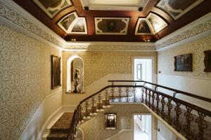 a staircase in a building with a ceiling at The Petersham in Richmond upon Thames