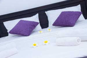 Letto o letti in una camera di Coco Palm Villa and Cabanas