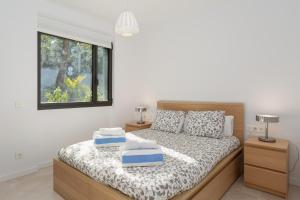 a bedroom with a bed and two night stands at 4 Bedroom Modern House, Llafranc, Costa Brava in Llafranc +25 photos