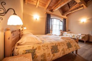 Posteľ alebo postele v izbe v ubytovaní Family House Amalia Myholidaylivigno