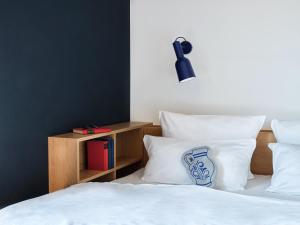 Cama ou camas em um quarto em STAYERY Frankfurt Sachsenhausen