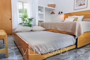 Un ou plusieurs lits dans un hébergement de l'établissement VILLA GADI - Roof Garden - Pizza Oven - Tiny Pool 33 autres photos