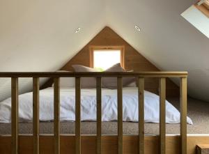 a bedroom with a bed in a attic at Quirky Barn Conversion Crowhurst Battle in Crowhurst