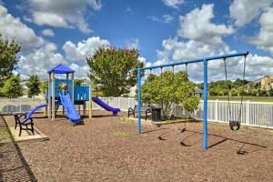 a playground with a blue slide and swings at Gorgeous Lewes Getaway about 3 Mi to the Beach! in Lewes