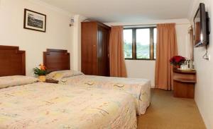 Postel nebo postele na pokoji v ubytování Jasmine Hotel + 36 fotografií