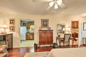 a living room with a ceiling fan and a kitchen at College Station Studio Less Than 1 Mi to Kyle Field! in College Station