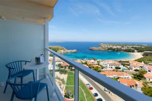 a balcony with a view of the ocean at Palladium Hotel Menorca in Arenal d'en Castell