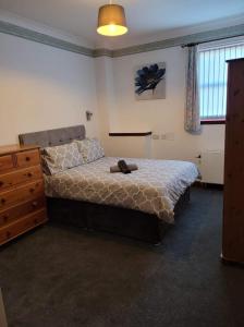 A bed or beds in a room at Weston House