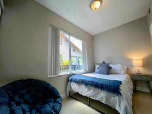 a bedroom with a bed and a window at Marlins Park Suites - Apartment 1 - Calle Ocho Suite in Miami