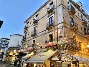 a building with a store in front of it at La Maison del Bell'Antonio - Catania downtown in Catania