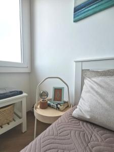 a bedroom with a bed and a table with a laptop at MareNostrum in Pieve Ligure +24 photos