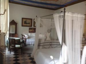 Impero Luxury Apartment tesisinde bir odada yatak veya yataklar