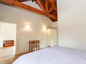 Ένα ή περισσότερα κρεβάτια σε δωμάτιο στο Wren cottage
