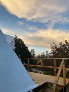 a wooden deck with a skateboard on top of it at Alas Glamping La Cima in Guatavita