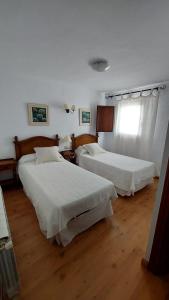 Ένα ή περισσότερα κρεβάτια σε δωμάτιο στο Casa Rural Rio los Molinos